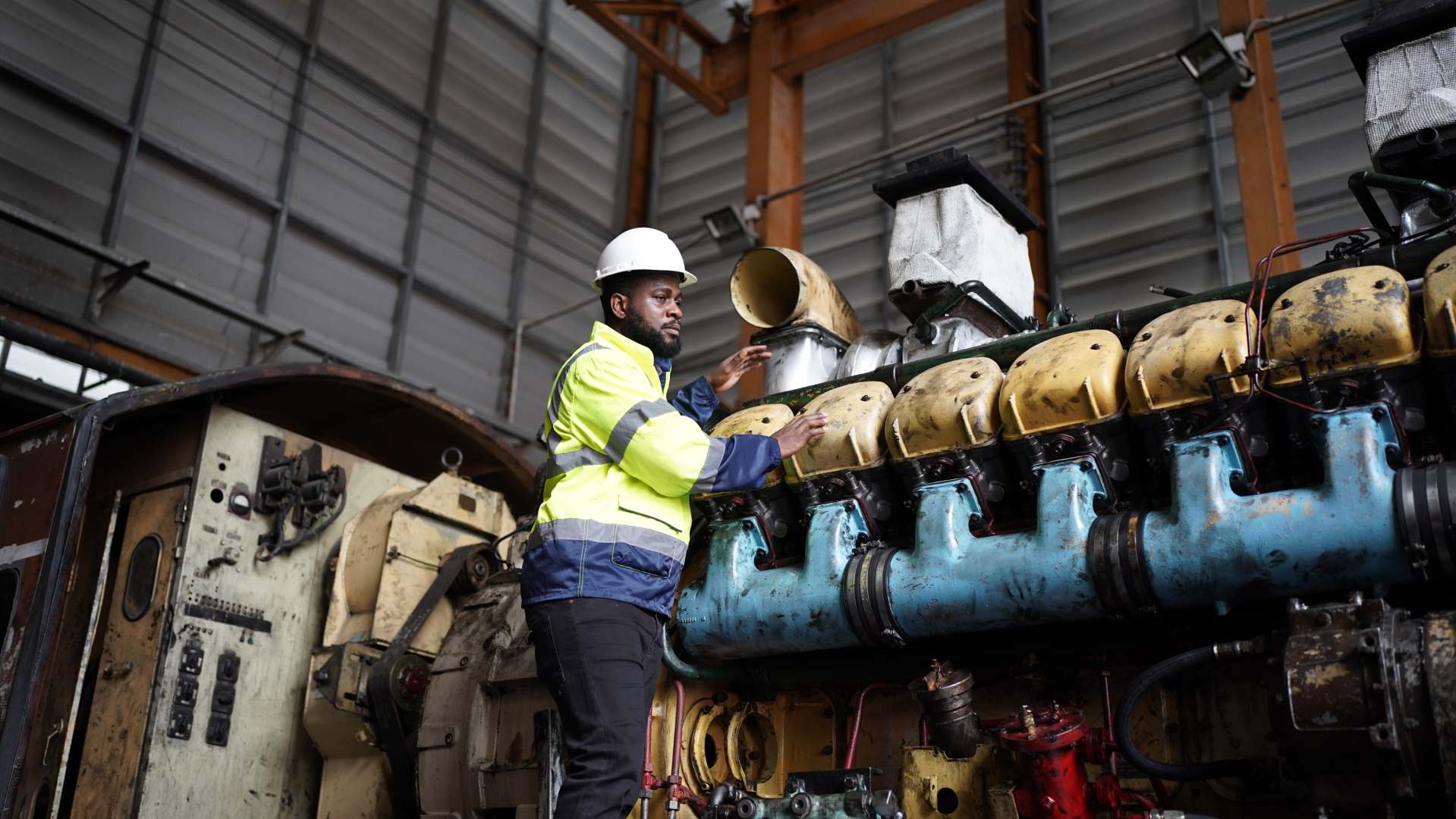 Portrait of maintenance engineer or apprentice in workshop of railway engineering facility